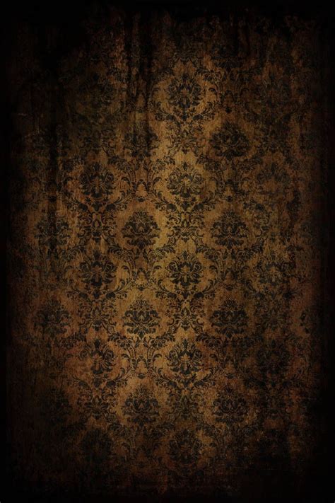 an old fashioned wallpaper with black and gold colors