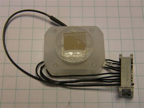 9-Detailed view of the wet chemical sample cell. (a) before covering ...