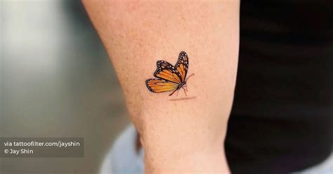 Micro-realistic style yellow butterfly tattoo done on