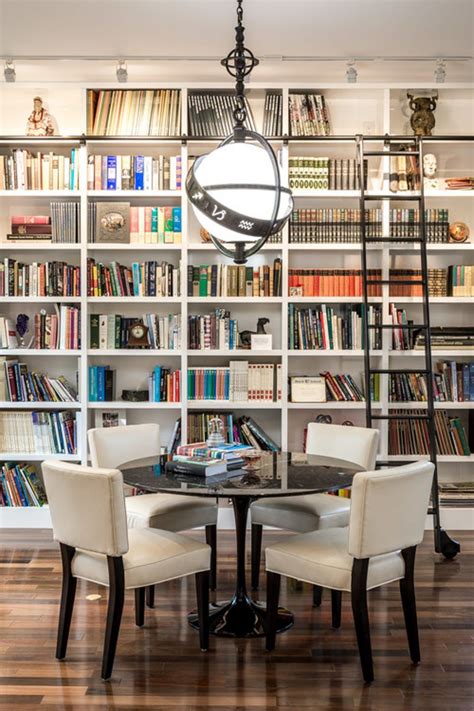 Dining room library with a wall of bookshelves and a ladder | Small ...