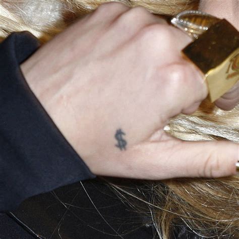 Kesha Dollar Sign Back of Hand Tattoo | Steal Her Style