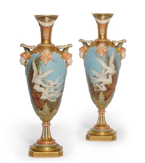 A PAIR OF ROYAL WORCESTER TWO-HANDLED VASES , DATE CODE FOR 1903, GREEN ...