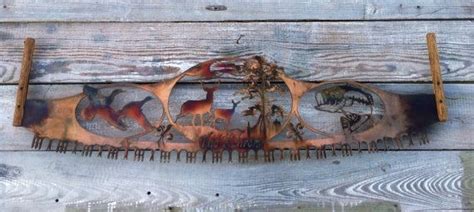 an art piece on the side of a wooden wall with animals and trees ...