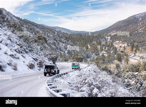 Cars travel out of town following a snow storm in Frazier Park ...