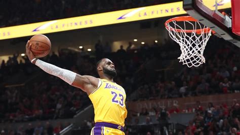 Watch: LeBron James has two huge dunks for first career Lakers points ...