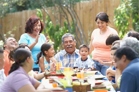 Three Generation Hispanic Family Sitting at Picnic Table - Public ...