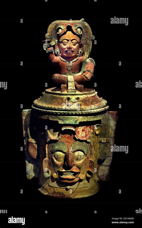 Funerary urn with depiction of the solar god Kinich Ahau and the image ...