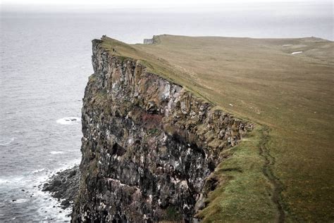 Gray and Green Cliff Near Sea · Free Stock Photo