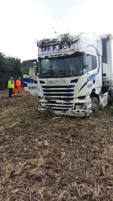 Pics: Tractors retrieve stranded articulated lorry from a field ...