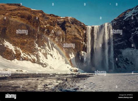 Skogafoss waterfall with rainbow landscape photo Stock Photo - Alamy