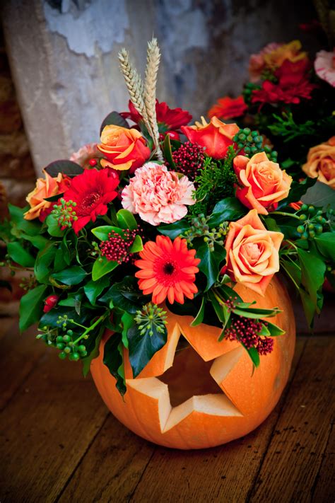 Our table flowers in pumpkins carved with hearts & stars. | Pumpkin ...