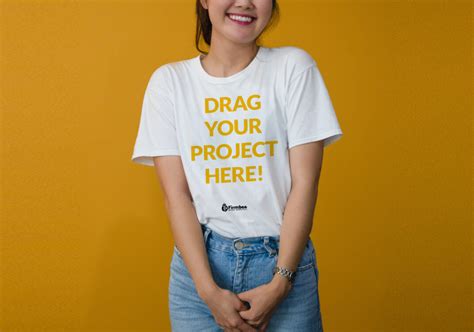 Smiling Girl wearing T-Shirt Mockup - Mockup World