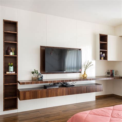 Wooden TV Unit Design With Wall-Mounted Storage Units | Livspace