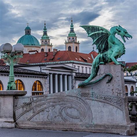 Four large dragons guard Ljubljana's Dragon Bridge in the capital of ...