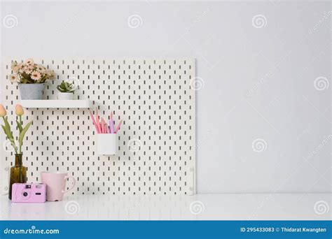 Stylish Desk Interior with White Table Background with Plant and Leaves ...