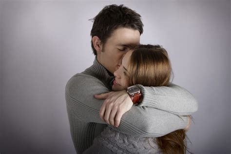 What does it mean when a guy initiates a hug? | Body Language Central