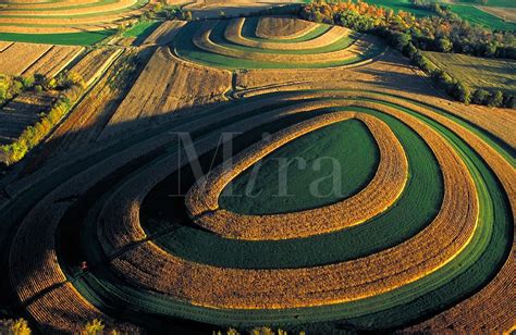 The drumlins left by a receding glacier are now being plowed for ...