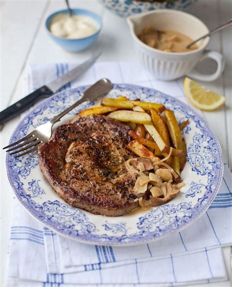 Ultimate steak and chips with a rich mushroom sauce - delicious. magazine