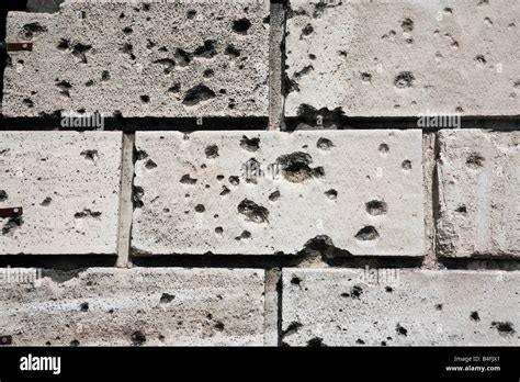 Bullet holes in a wall Stock Photo - Alamy