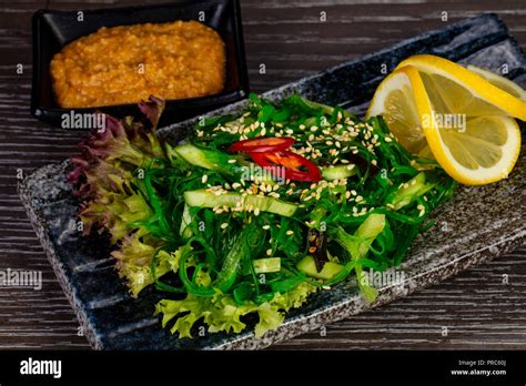 Bright green kaiso salad with lemon Stock Photo - Alamy