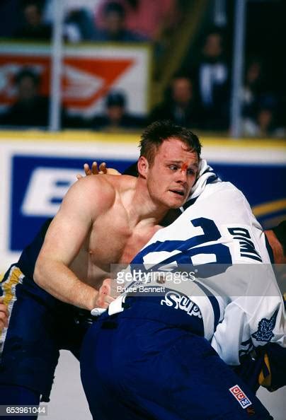 Rob Ray of the Buffalo Sabres fights with Tie Domi of the Toronto ...