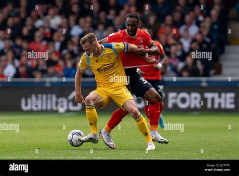 Michael Morrison #4 of Reading battle for the ball Cameron Jerome #35 ...