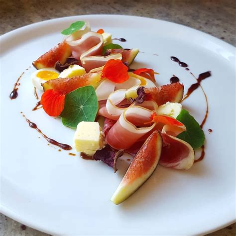 Prosciutto, cheese, quail egg, fig, dehydrated beetroot, nasturtium and ...