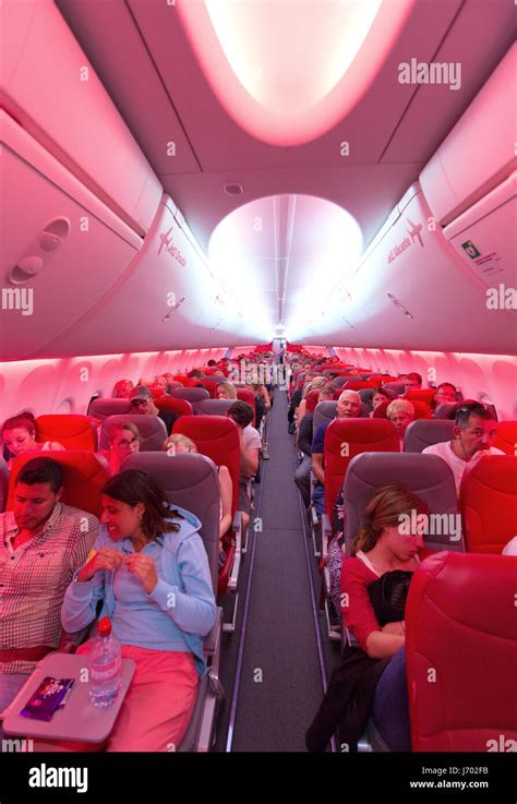 Aircraft passengers in the plane cabin of a Jet2 airline Boeing 737-800 ...