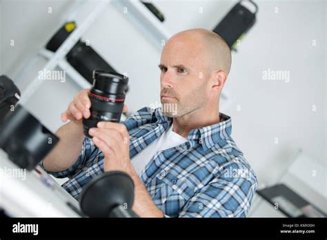 photographer setting camera Stock Photo - Alamy