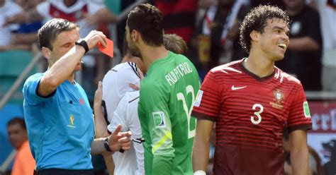 Milorad Mazic shows the red card to Portugal's Pepe (R) during the FIFA ...