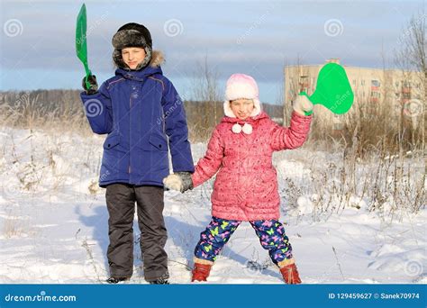 Children Playing in the Snow Stock Image - Image of outdoor, holiday ...