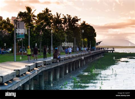 View along the Esplanade boardwalk at dusk. Cairns, Queensland ...