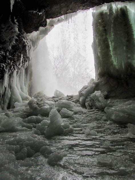 I found an ice cave behind a waterfall on my hike earlier today : r/pics