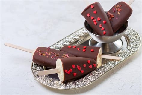 Premium Photo | Homemade ice cream on a stick with chocolate icing