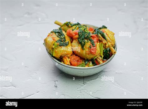 Indonesian Spicy basil chicken Ayam Woku Stock Photo - Alamy