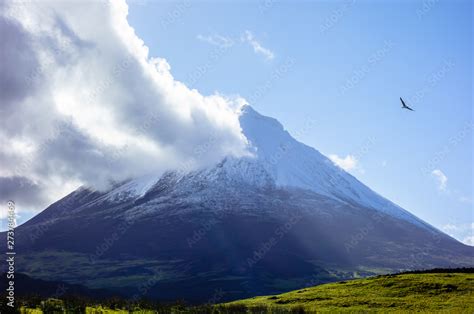 Mount Pico volcano with cloud touching summit. Stock Photo | Adobe Stock