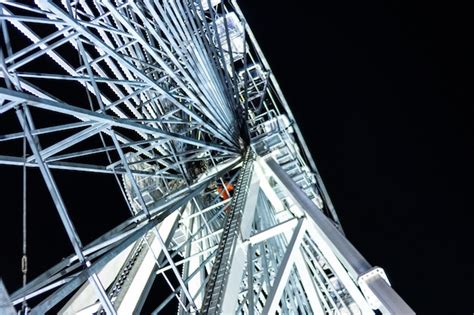 Premium Photo | View from below of a ferris wheel at night