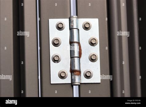 Close up image of stainless door hinges on a metal door Stock Photo ...