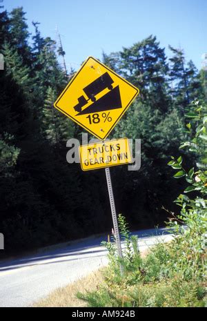 steep road sign with a truck driving down a steep downgrade in black ...