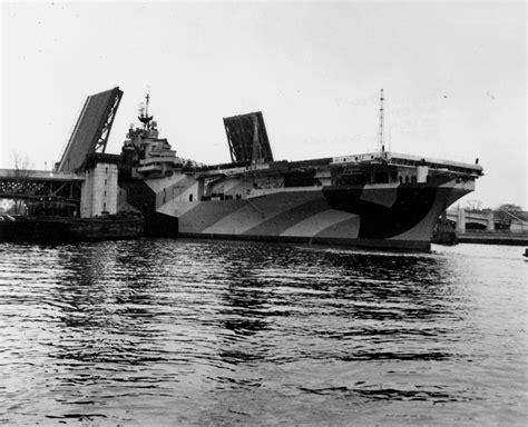 WWII Carriers — Essex-class Aircraft Carrier Hancock moving past...