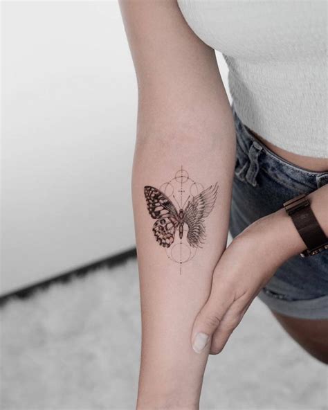 Single needle butterfly with an angel wing tattoo