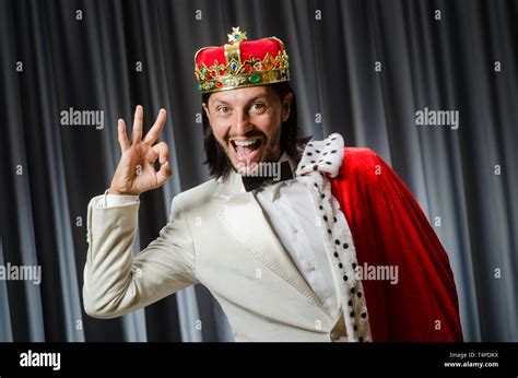 Funny king wearing crown in coronation concept Stock Photo - Alamy