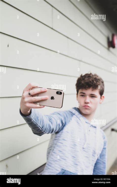 Teenage boy taking a selfie with his new iPhone X Stock Photo - Alamy