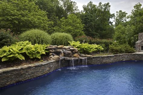 Stone waterfall Premier Pool Renovations | Hardscape, Outdoor, Custom pools