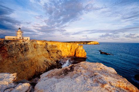 View Of A Lighthouse On A Cliff Cabo Rojo Puerto Rico Photograph by ...