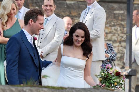 Downton Abbey star Michelle Dockery stuns in satin white gown as she ...