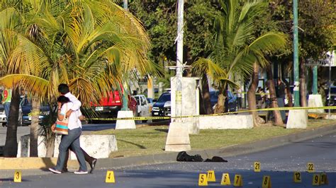 With 14 killings in 36 hours in Cancun, tourists urged to be cautious