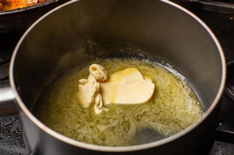 Premium Photo | Melt the butter in a saucepan the initial stage of ...