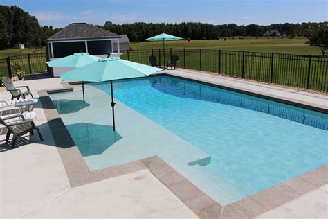 Swimming Pool with Sun Shelf | The Pool Company Construction | Pools ...