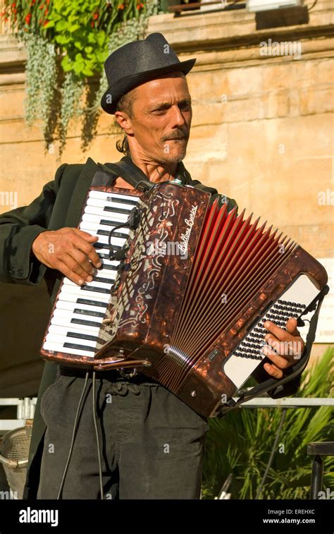 Piano accordion player, wearing a hat Stock Photo - Alamy